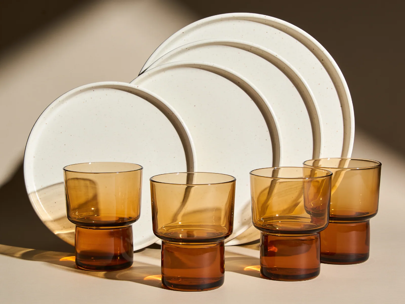 First Table — Four settings — dinner plates and tumblers